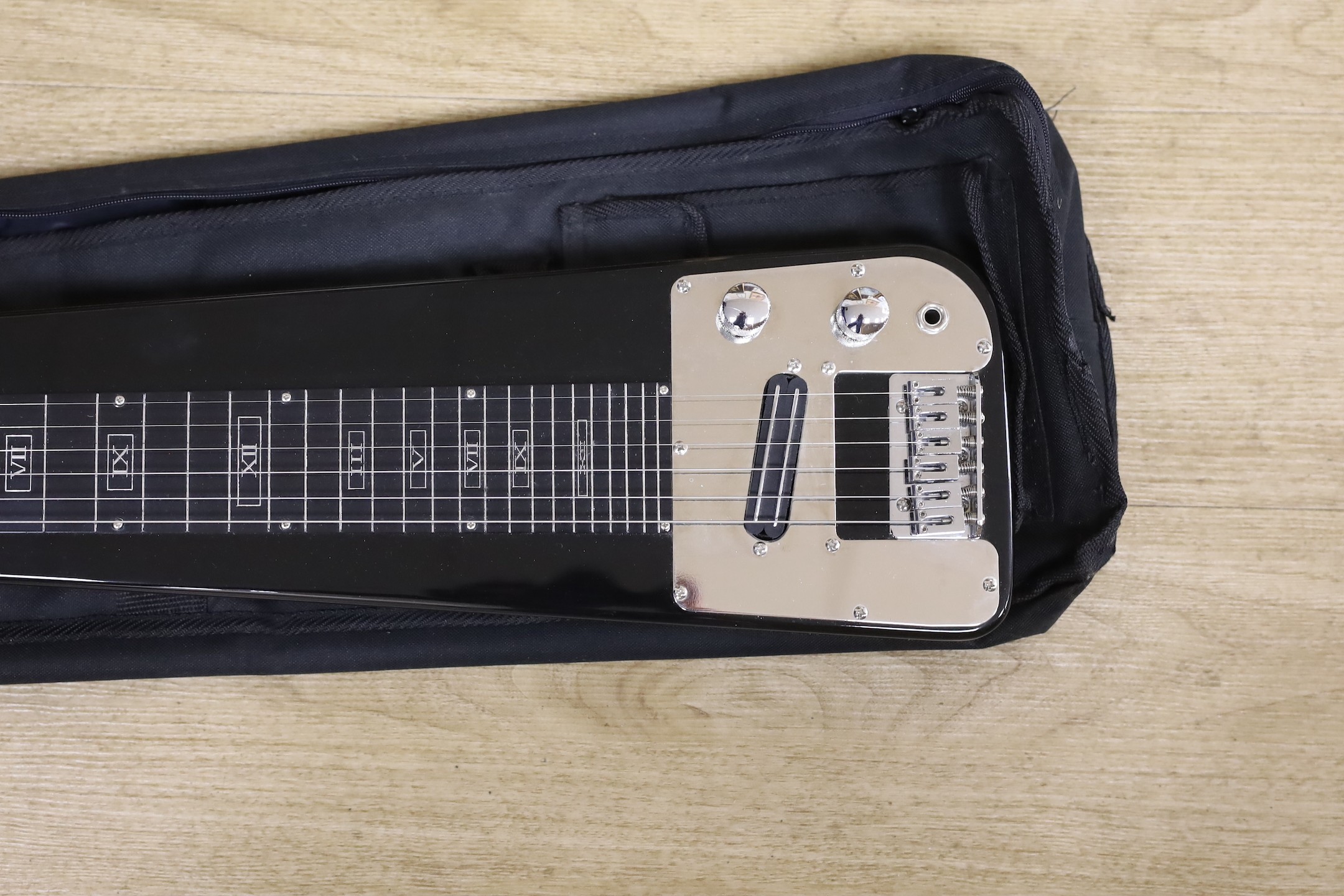 A Tenaro lap steel guitar, 74 cms long.